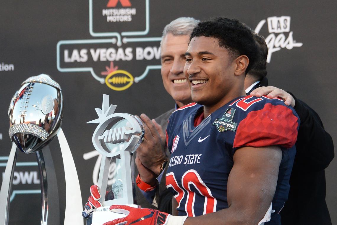 MVP Ronnie Rivers accepts his trophy during a post-game presentation following Fresno State’s victory over Arizona State in the Mitsubishi Las Vegas Bowl at Sam Boyd Stadium in Las Vegas on Saturday, Dec. 15, 2018.
