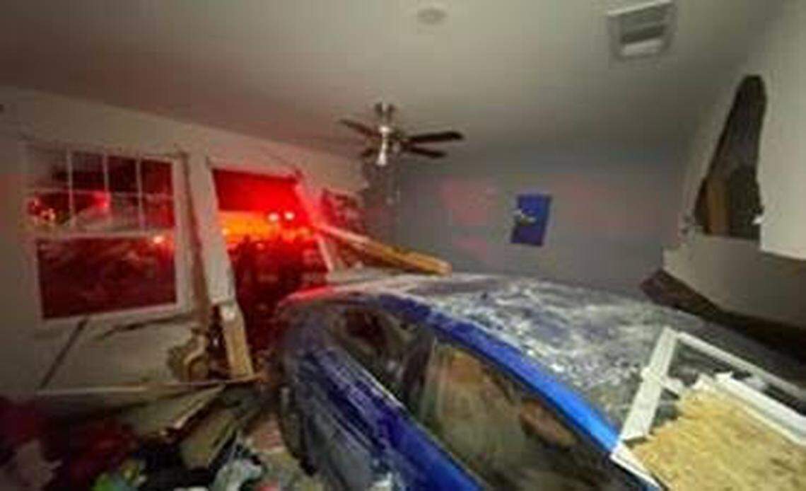 Police say the victim was asleep when the car slammed into the home.