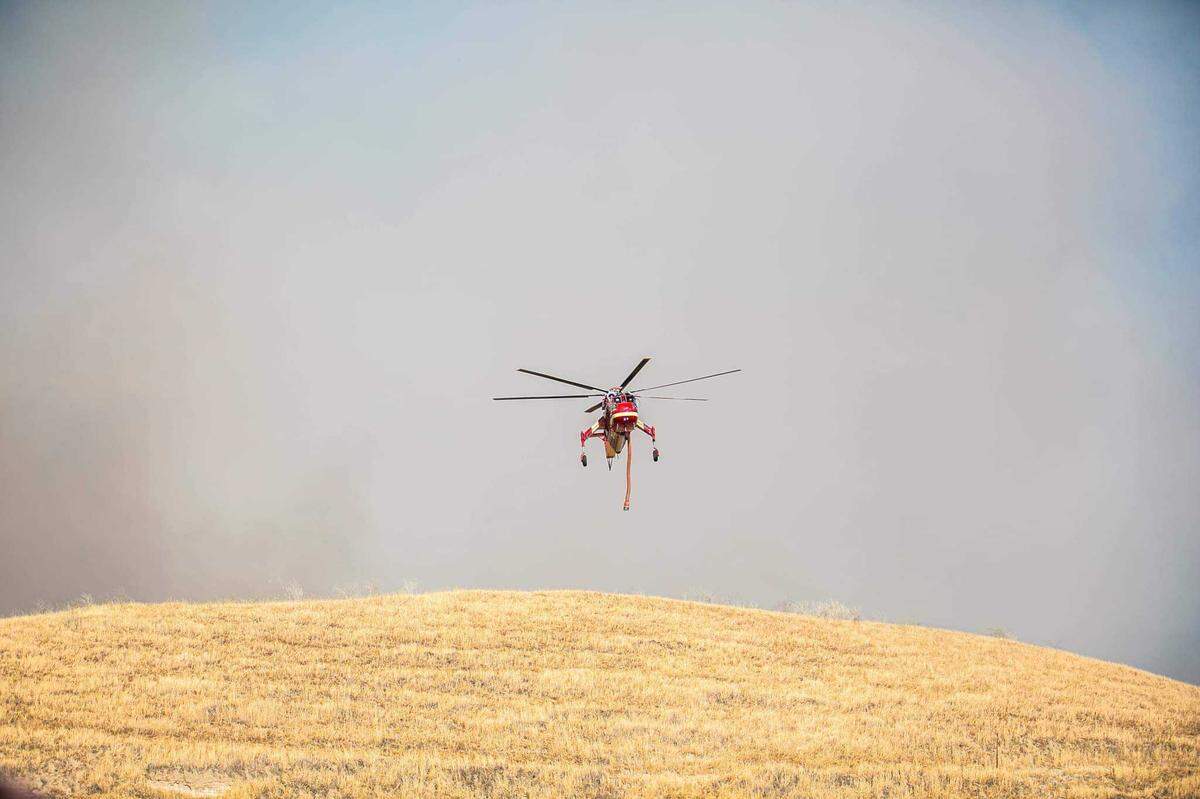 Air and ground units were involved in battling a 125-acre grass fire off Friant Road in Fresno County, California on Sunday, June 27, 2021.