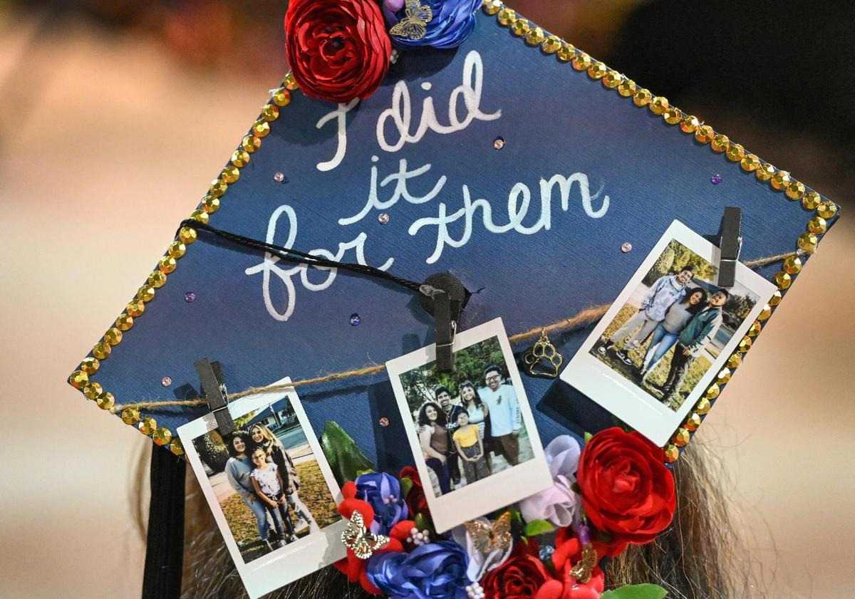 Jenny Gonzalez wore a graduation cap decorated with pictures of her family and the words “I did it for them” while accepting her master’s degree in social work during the 47th annual Fresno State Chicano/Latino Commencement Celebration at the Save Mart Center on Saturday, May 20, 2023.