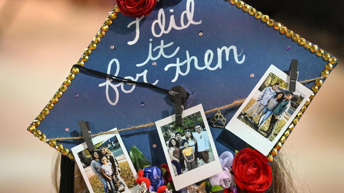 Jenny Gonzalez wore a graduation cap decorated with pictures of her family and the words “I did it for them” while accepting her master’s degree in social work during the 47th annual Fresno State Chicano/Latino Commencement Celebration at the Save Mart Center on Saturday, May 20, 2023.