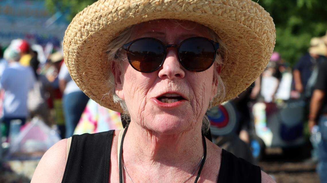 Nancy Schultz, a retired lawyer, takes part in the May Day demonstration against Trump administration policies on Blackstone near Alluvial in Fresno on May 1, 2025.