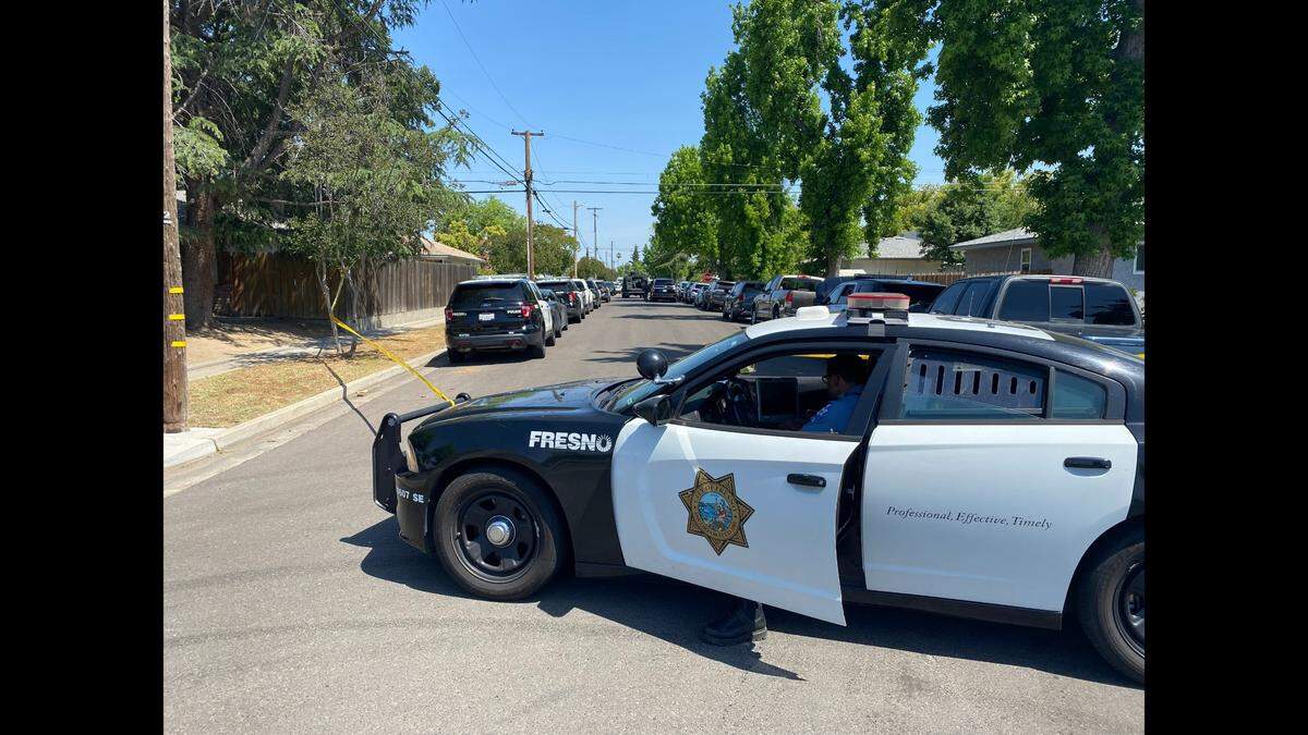 Police and SWAT set up a perimeter in a neighborhood northwest of Dakota and Cedar avenues Friday, May 12, 2023, after a man suspected of three shootings fled from officers, police said.