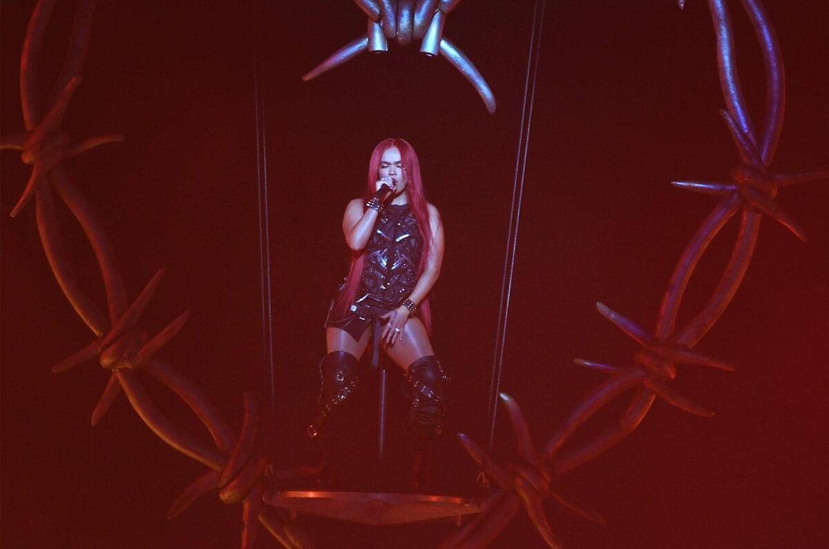 Karol G performs suspended above the stage, bringing her Strip Love Tour to a packed house at the Save Mart Center Tuesday, Oct. 25, 2022 in Fresno.