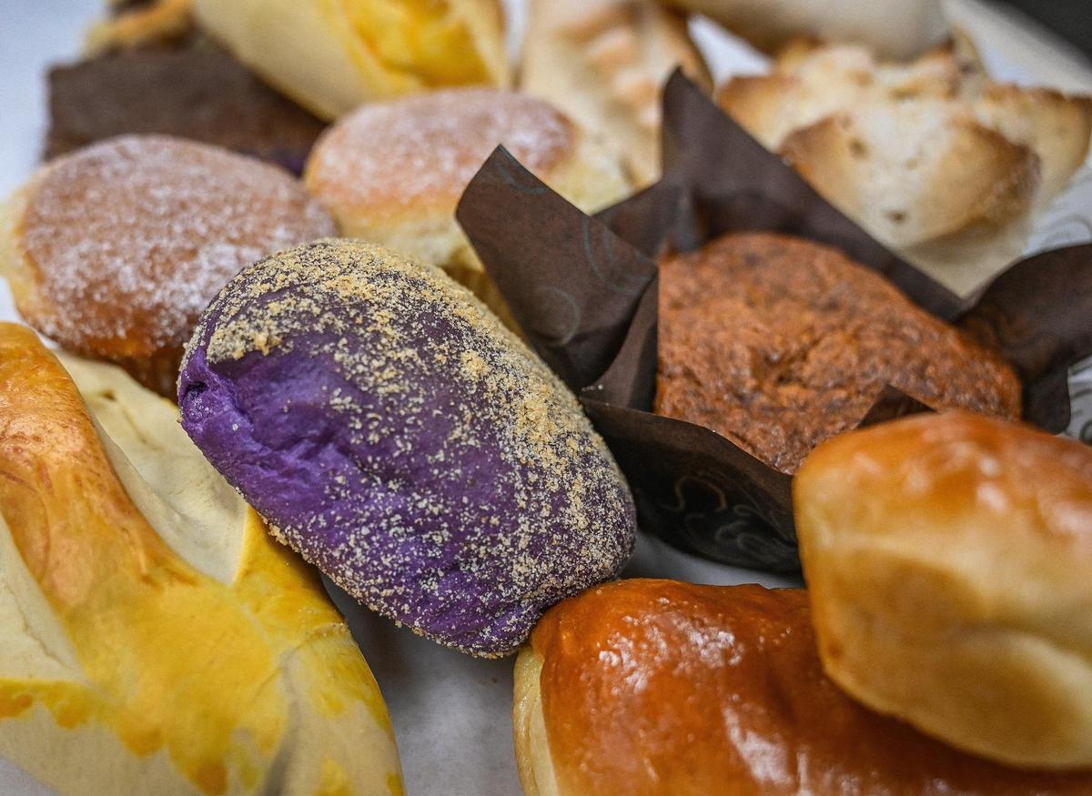 Various breads including some made with ube purple yam dough at Bread and Butter Filipino bakery, which recently opened near Fresno Street and Gettysburg Avenue.