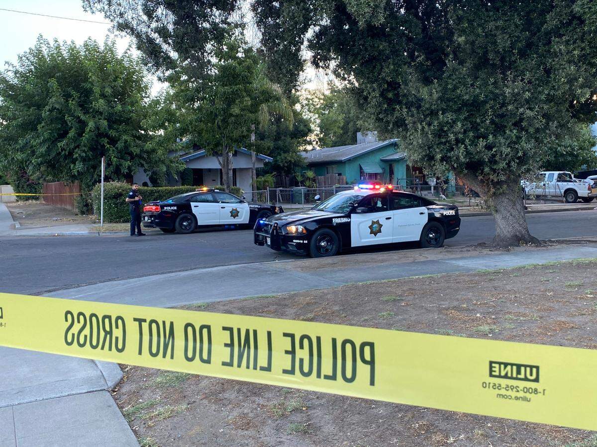 Fresno police investigate the scene of a fatal shooting on Grant Avenue near Belmont Avenue on Tuesday, July 25, 2023.