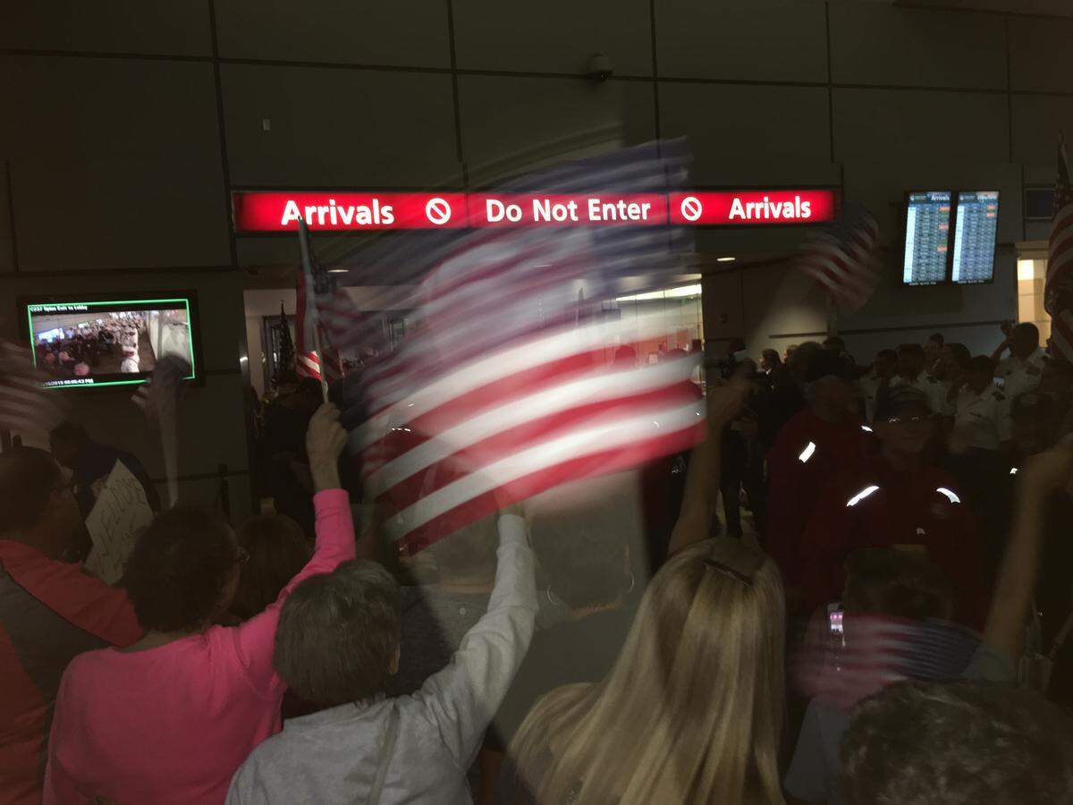 Crowds cheer and wave American flags as the 19th Central Valley Honor Flight returned to Fresno on Wednesday, May 15, 2019.