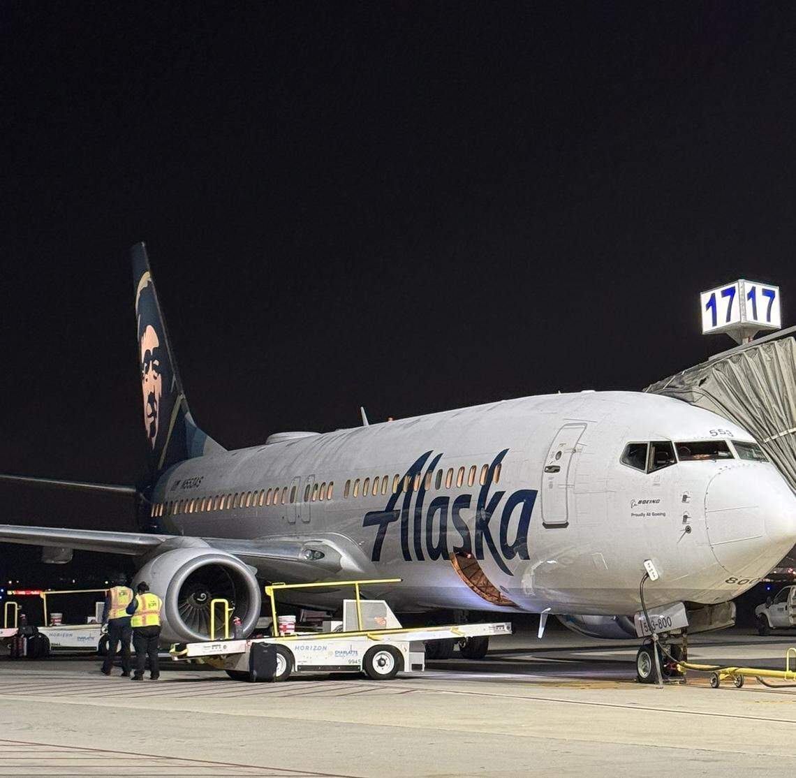 An Alaska Airlines jet sits at a gate at Fresno Yosemite International Airport.