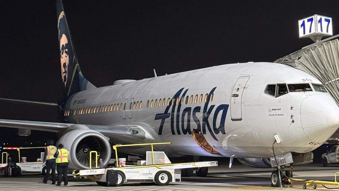 An Alaska Airlines jet sits at a gate at Fresno Yosemite International Airport.