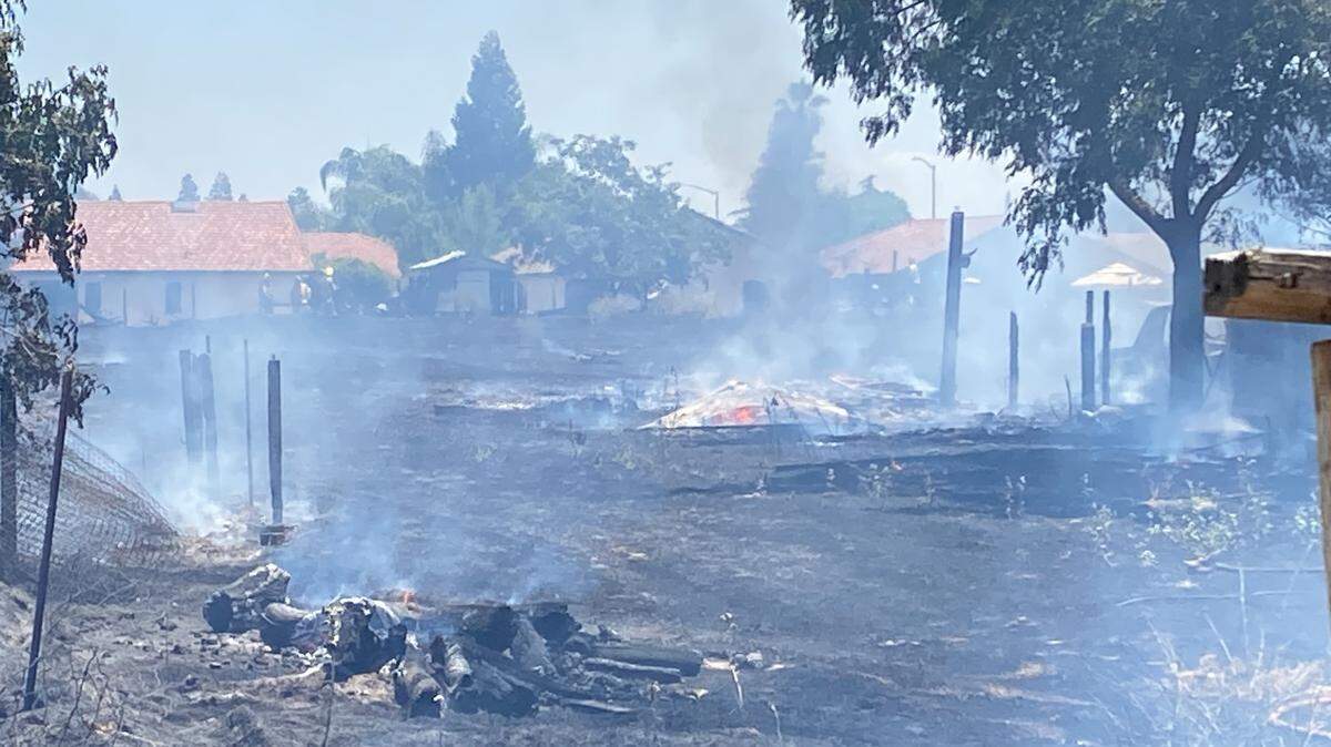Crews knocked down a grass fire that was deemed suspicious on Cornelia Avenue, between Clinton and McKinley avenues in Fresno, California on Thursday, June 6, 2024.