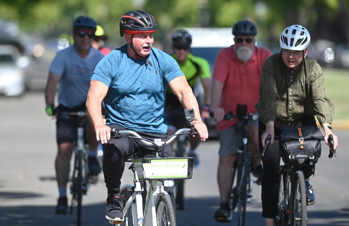 Fresno Mayor Jerry Dyer rides along Huntington Blvd with others to help kickstart May as Bike Month, Wednesday, May 10, 2023 in Fresno.