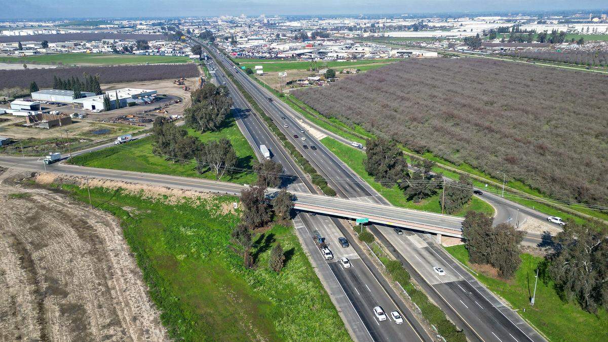 Traffic on Highway 99 flows beneath the American Avenue overpass where Caltrans is planning a project to reconstruct and expand the interchange to make way for future industrial development. Fresno Building Healthy Communities, the Friends of Calwa and local residents have filed a lawsuit arguing that Caltrans has violated laws by hiding the full scope of the project and making the area less safe for residents.  