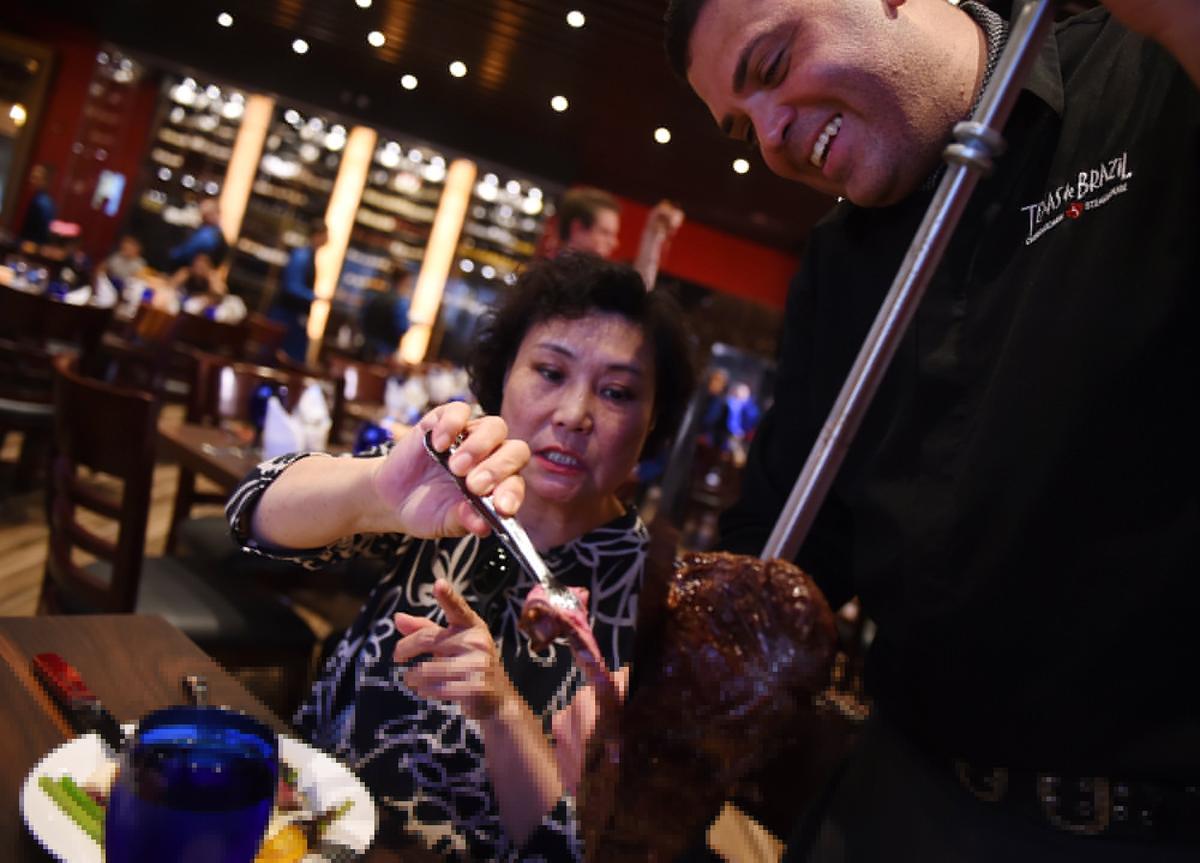 Meat is served at the Texas de Brazil in River Park in this file photo from 2018.