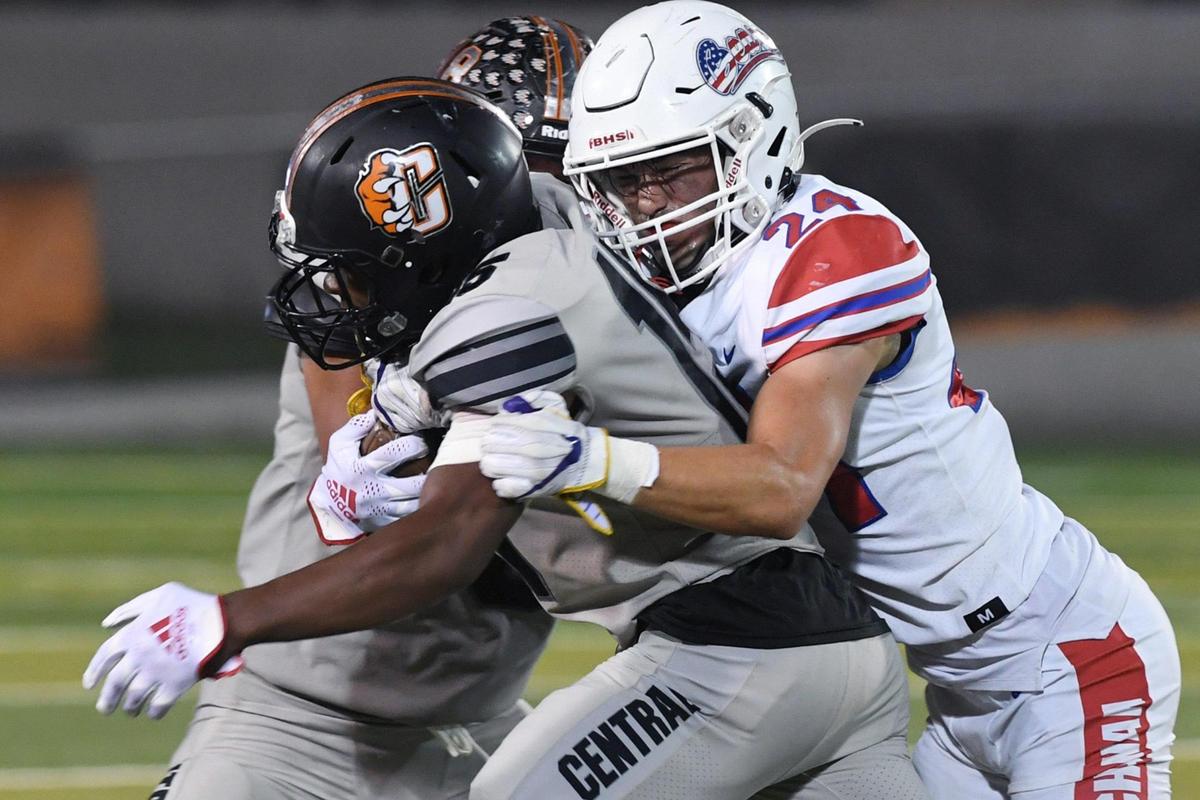 Buchanan’s Cheney Bishop, right, tackles Central’s Imari Conley, left, Friday, Oct. 7, 2022 in Fresno. Buchanan won 49-41.
