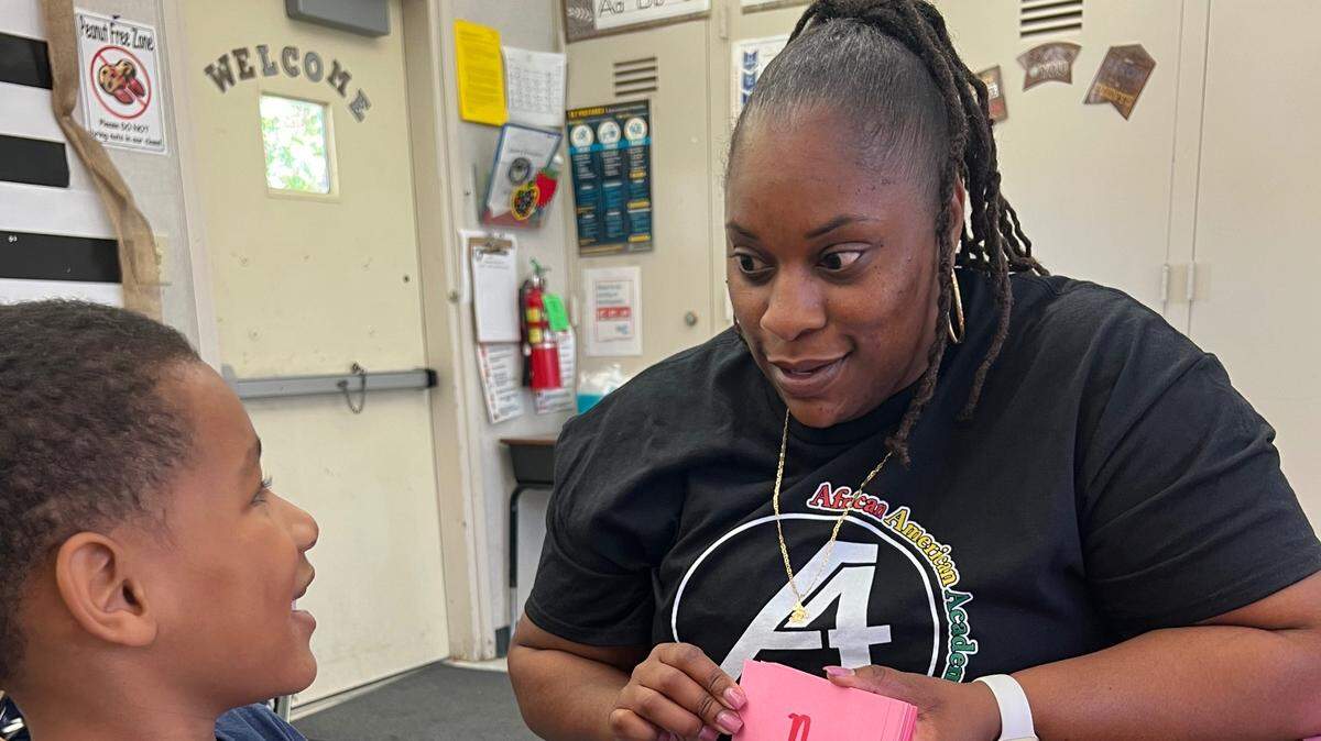 Wilson Elementary teacher Kathy Tennison works with a Fresno Unified student during the African American Academic Acceleration summer program.