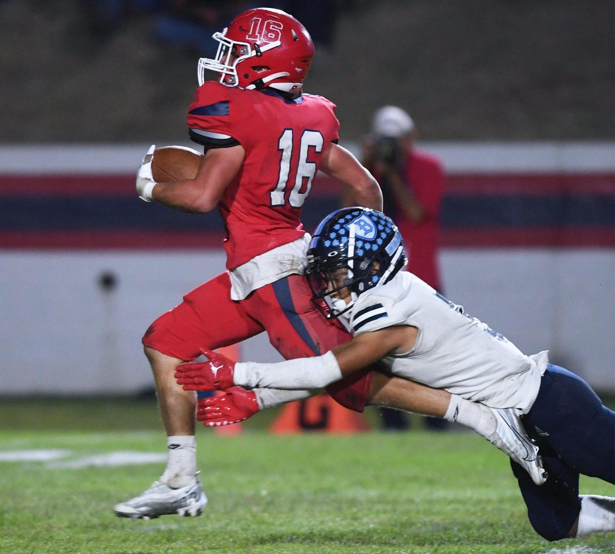 Bullard’s Eddie Torres, right, tackles Sanger’s Marshall Pittman as Pittman falls into the end zone for Sanger’s last touchdown of the game toppling Bullard 42-6 at Tom Flores Stadium Friday, Oct. 21, 2022 in Sanger.