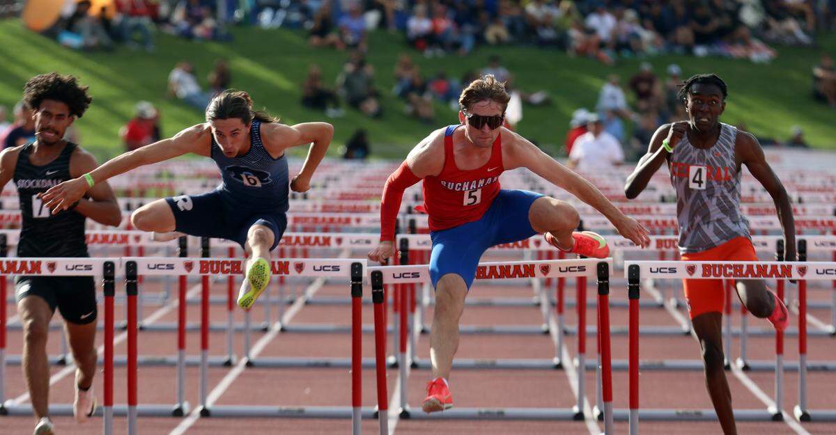 Buchanan High senior Hudson Hergenrader (13.85) powered past Redwood High sophomore Wyatt Ruby (13.93) and Central East junior Jaylen Jackson (14.30) win the boys 110-meter hurdles at the CIF Central Section Masters Track and Field Championships at Buchanan High’s Veterans Memorial Stadium on May 24, 2025.
