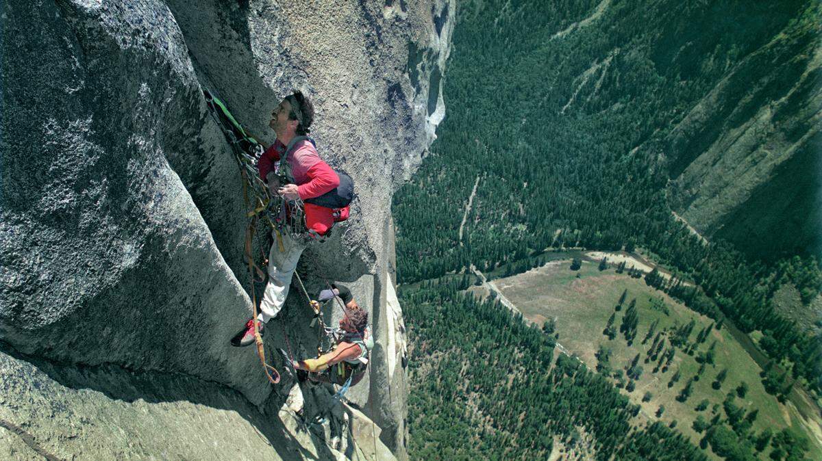 Mike Corbett leads a pitch on the Shield Route near the summit of El Capitan with Mark Wellman, July 1989.