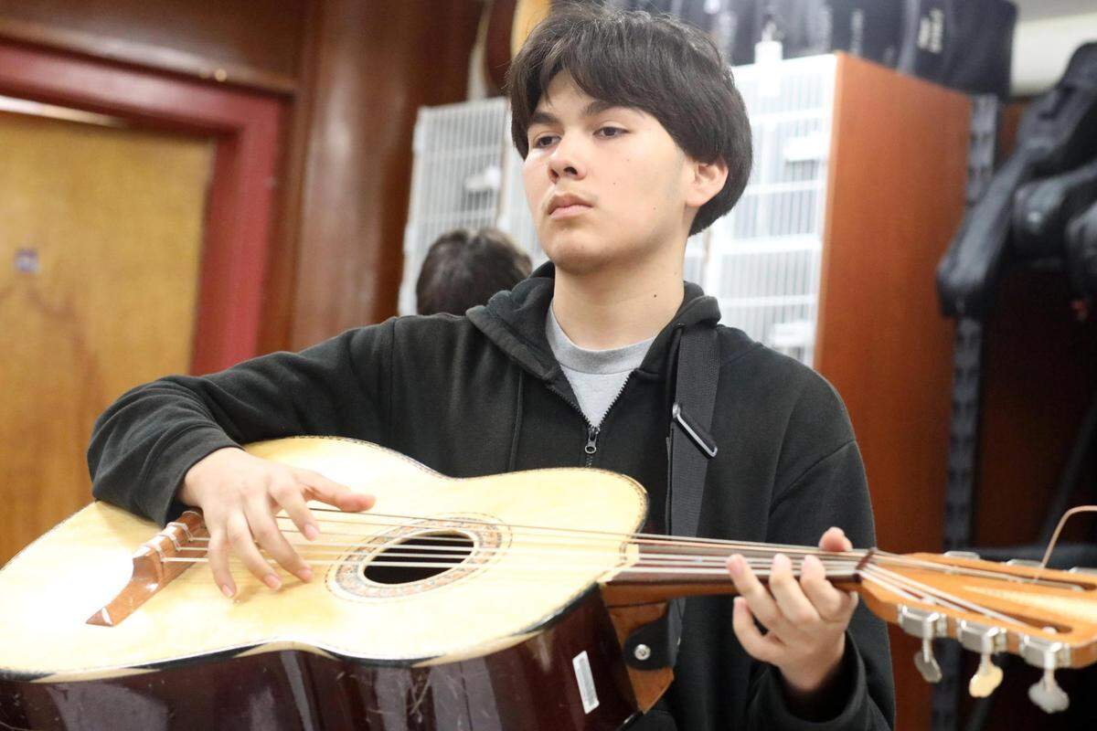 Orosi High School Mariachi Cardenal members during the mariachi class on Wednesday, March 15, 2023.
