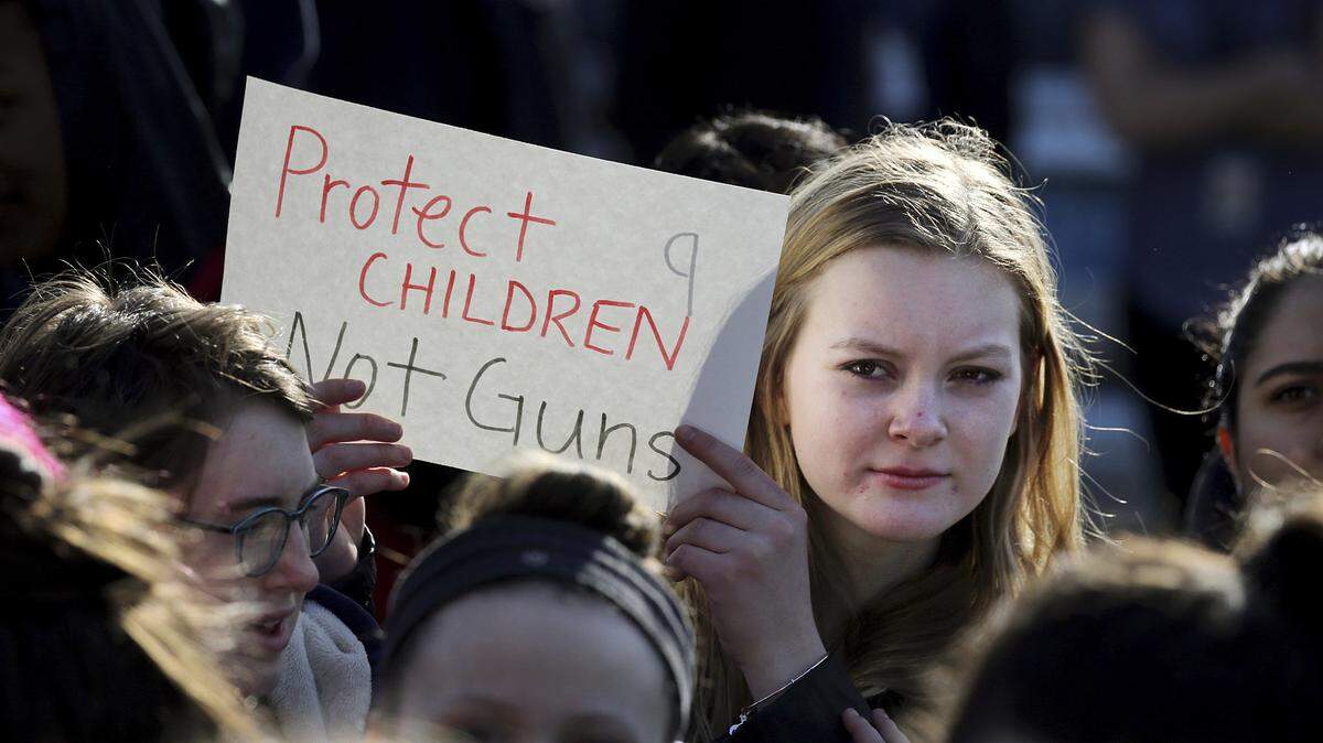 In this Feb. 28, 2018 photo, Somerville High School junior Megan Barnes marches with others during a student walkout at the school in Somerville, Mass. A large-scale, coordinated demonstration is planned for Wednesday, March 14, when organizers have called for a 17-minute school walkout nationwide to protest gun violence.