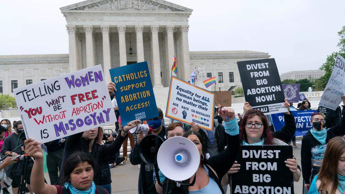 Demonstrators protest outside of the U.S. Supreme Court Tuesday, May 3, in Washington. A draft opinion suggests the U.S. Supreme Court could be poised to overturn the landmark 1973 Roe v. Wade case that legalized abortion nationwide, according to a Politico report released Monday. Whatever the outcome, the Politico report represents an extremely rare breach of the court’s secretive deliberation process, and on a case of surpassing importance.