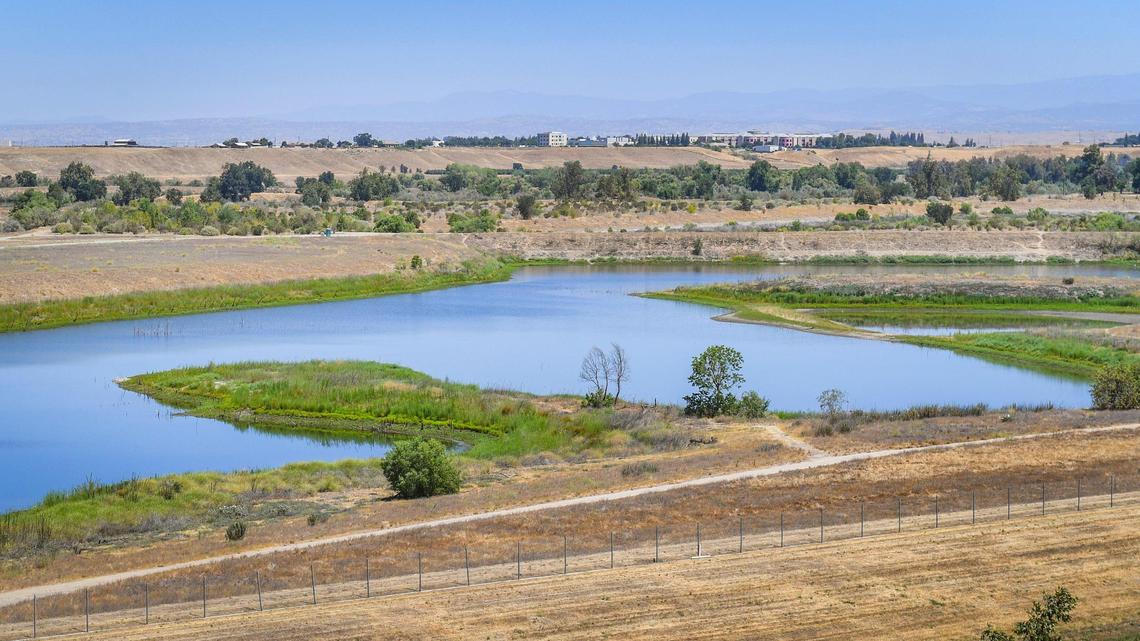 The San Joaquin River is seen from Spano Park in Fresno with Valley Children’s Hospital in Madera County visible in the distance on Tuesday, June 22, 2021. California Assembly Member Joaquin Arambula and Assembly Speaker Anthony Rendon were pushing for Assembly Bill 559 that would reshape the San Joaquin River conservancy board as well as $15 million earmark in the state budget for operations and maintenance of the San Joaquin River Parkway.