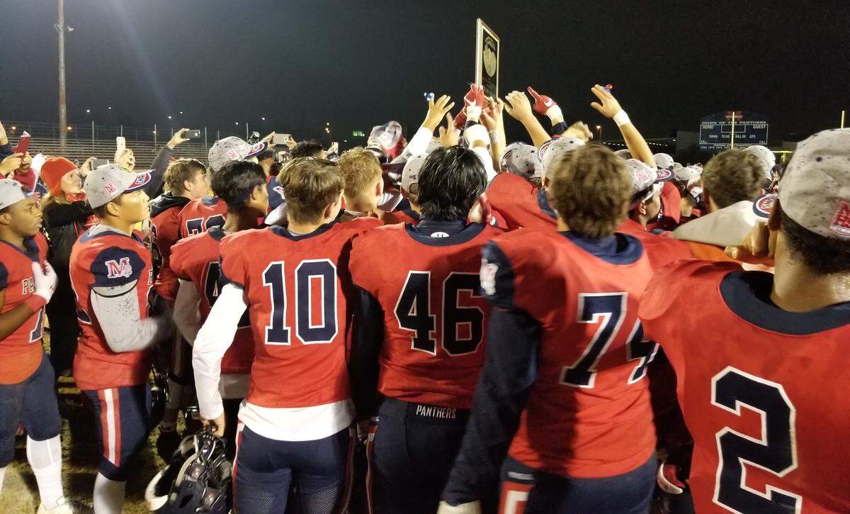 San Joaquin Memorial’s football team celebrates its second straight Central Section Division III football championship Friday night.