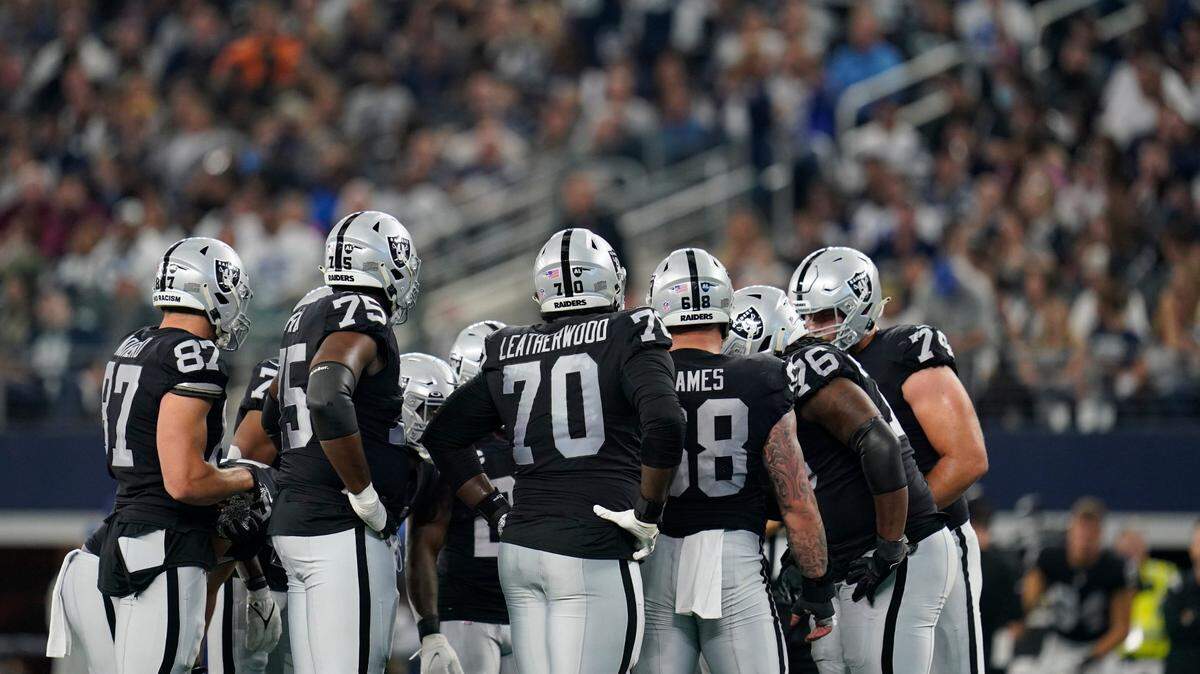 Las Vegas Raiders offensive group during a Thanksgiving day NFL game against the Dallas Cowboys, Thursday, Nov. 25, 2021, in Arlington, Texas.