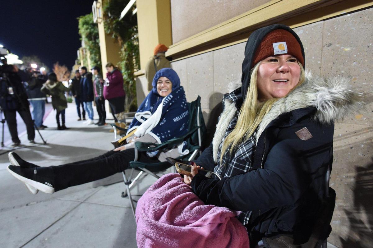 Jessica Fazela, right, and friend Christina Villegas, center, join other Black Friday shoppers for Target at River Park opening at 7 a.m., Nov. 26, 2021. Fazela, at the head of the line, had been there since 12:40 a.m. Disappointed but undeterred that the Starbucks collector mugs she collects were not in stock, she decided to stick it out and hunt for Christmas gifts.