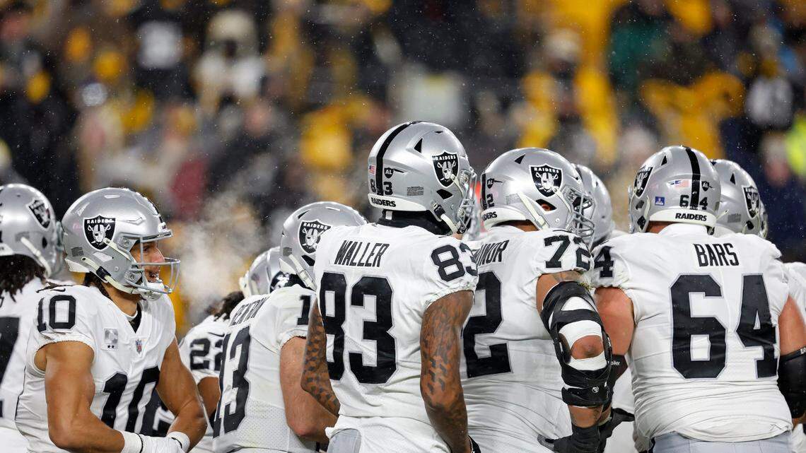 Las Vegas Raiders offense huddle during an NFL game against the Pittsburgh Steelers, Sunday, Dec. 24, 2022, in Pittsburgh.