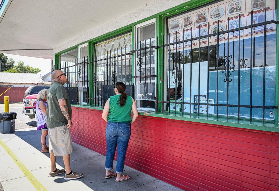 Customers stop to order at the window at Adrian’s, a longtime Fresno Mexican food favorite on Belmont near First Street near downtown Fresno, on Monday, June 24, 2024.