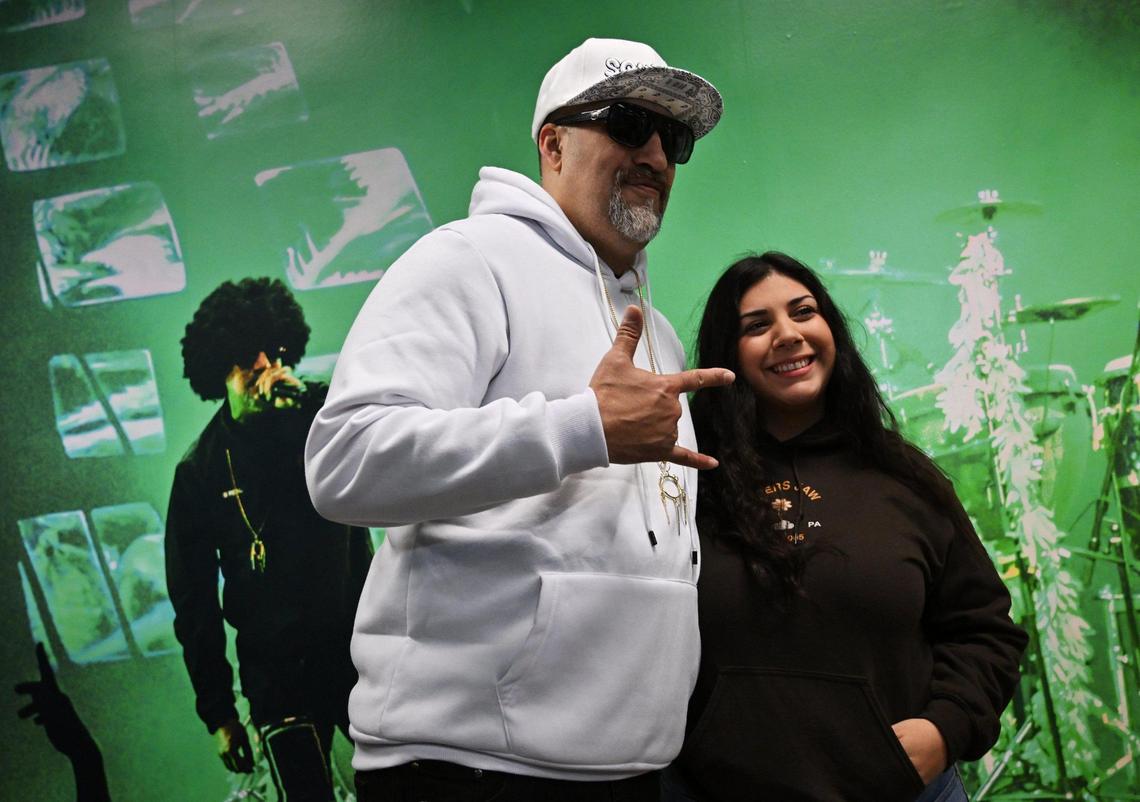 Hip hop group’s B-Real, left, poses with a fan at the grand opening for Dr. Greenthumbs, Fresno newest cannabis dispensary, Saturday morning, April 6, 2024 in Fresno.