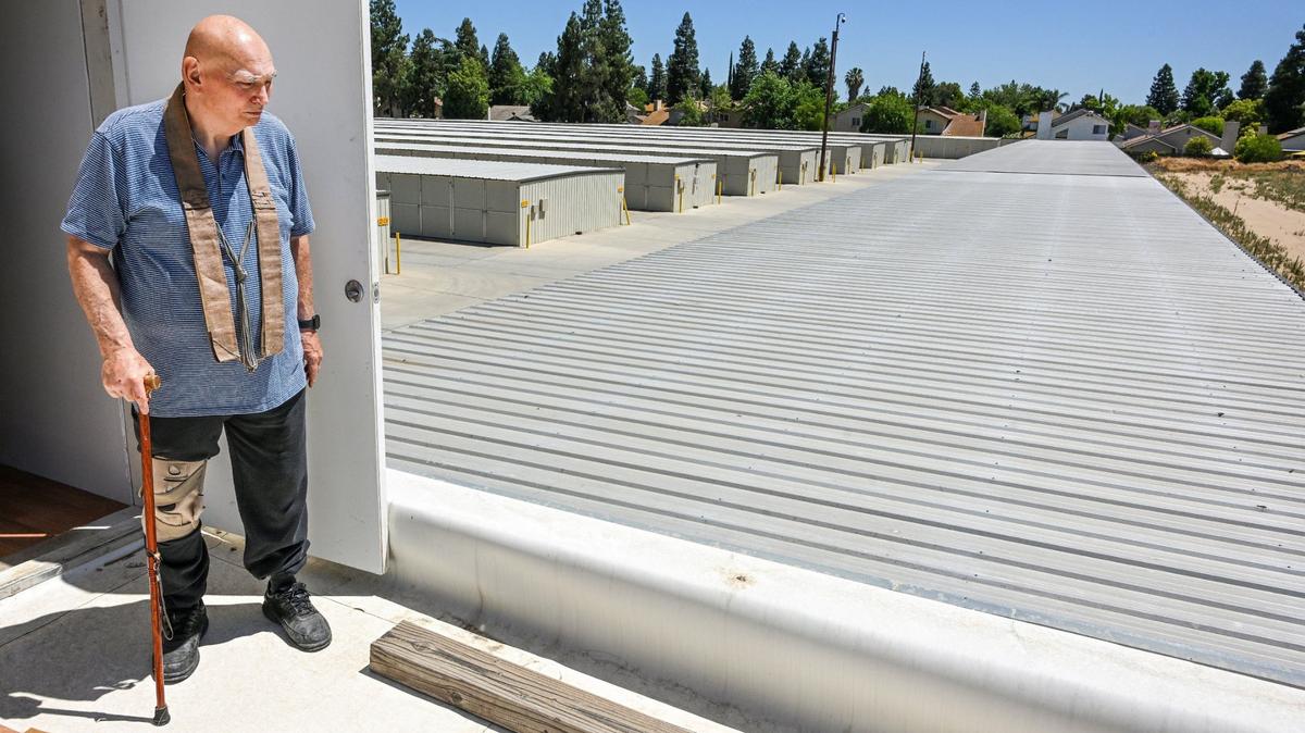 Shingon Buddhist priest Bill Eidson stands on a west-facing rooftop of the Shingon Buddhist International Institute building adjacent to a Derrel’s Mini Storage on Nees Avenue near Millbrook in north Fresno on Thursday, June 27, 2024.