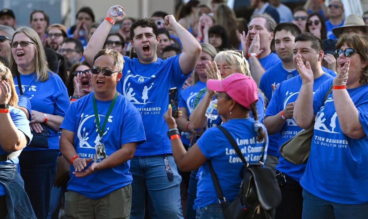 The crowd cheers for a speaker as over a thousand teachers and supporters gathered for an Education Rally & Block Party organized by Fresno Teachers Association along N Street Wednesday, May 24, 2023 in downtown Fresno.