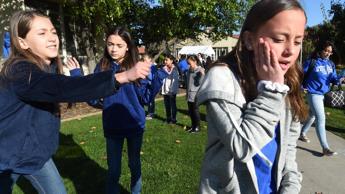 Sanger Unified’s Lone Star Elementary students from left, Evie Gilster, fifth grade, Bella Padilla, sixth grade, and Olivia LeBeau, sixth grade, practice their interpretation of Shel Silverstein’s “Nobody,” before their performance at the 61st Peach Blossom Festival, Thursday March 14, 2019. They were among the over 5,000 students in grades 1-6 from throughout the Central Valley who took part in the festival, an interpretive literature performance event, hosted at Fresno State. The festival was created to help young people realize the importance and joy of reading literature aloud, to show them the magic of oral interpretation and performance, to provide firsthand experience on how to be a respectful and enthusiastic audience member and to give students from all backgrounds an opportunity to visit a university campus.