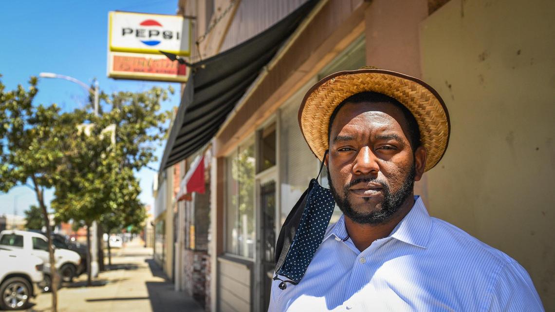Tate Hill, left, owner and chief strategist of Urban Strategic Enterprises, a public relations and community development consulting company, stands outside Chef Paul’s restaurant in Fresno’s Chinatown on Wednesday, July 1, 2020. Hill says there are only a handful of Black-owned businesses like Chef Paul’s in southwest Fresno and a small minority of businesses, mostly sole-proprietorships, across the city.