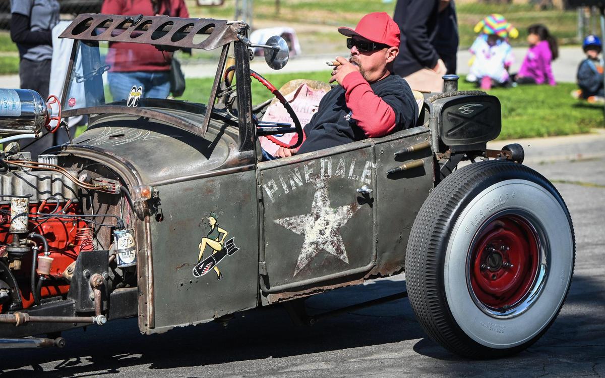 Pinedale resident Fred Esparza rides in his roadster during the parade honoring Pinedale’s centennial on Saturday,