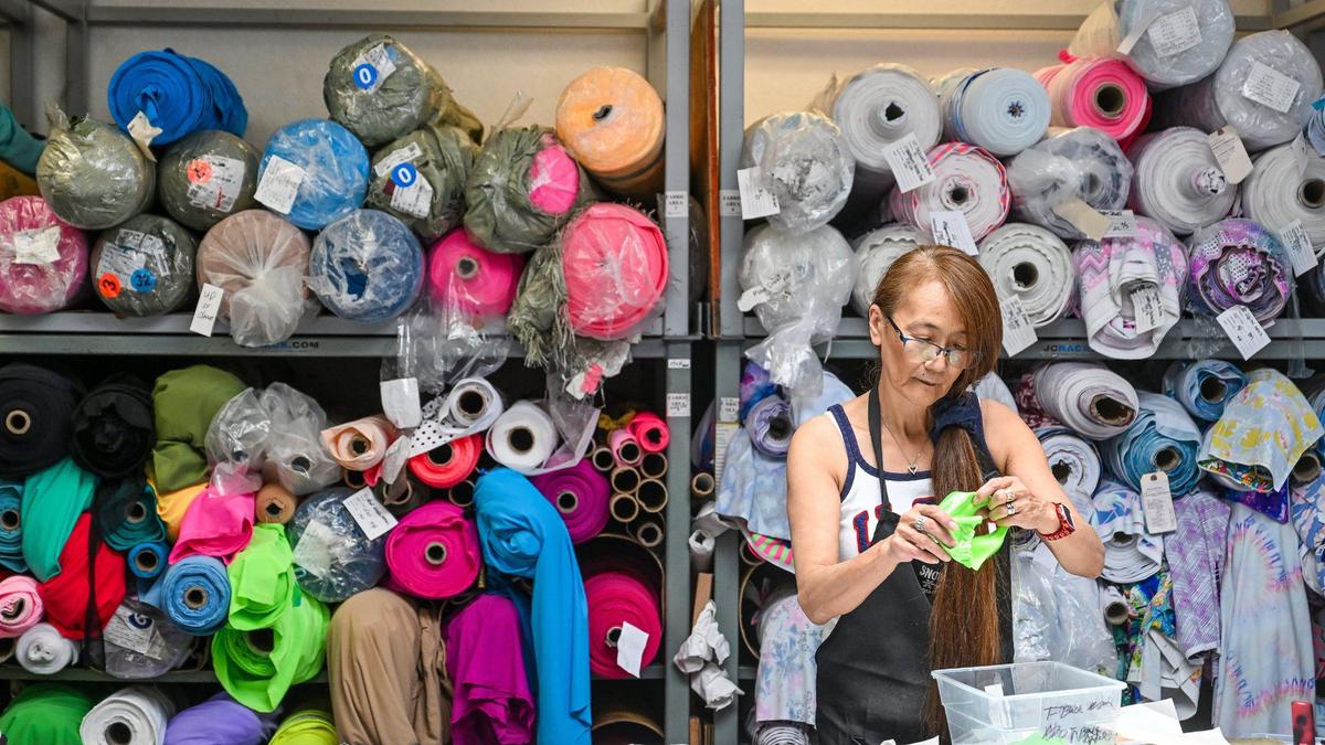 Kanako Gleim works with material on a leotard at Snowflake Designs, a gymnastic wear design and manufacturing company in Clovis on Friday, July 26, 2024.