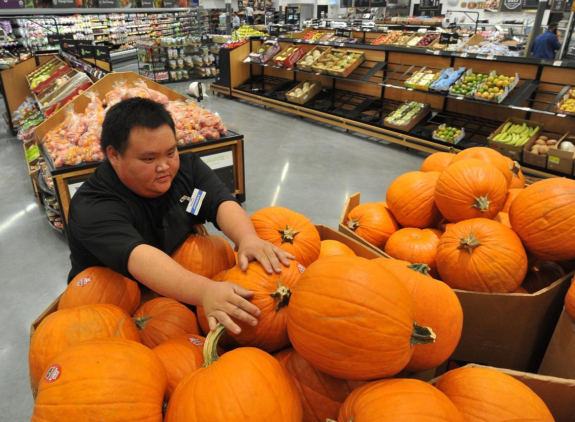 Just in time for Halloween, Johnny Her puts out pumpkins at the new Walmart Supercenter at Shaw and Brawley, Tuesday morning, Oct. 23, 2018.