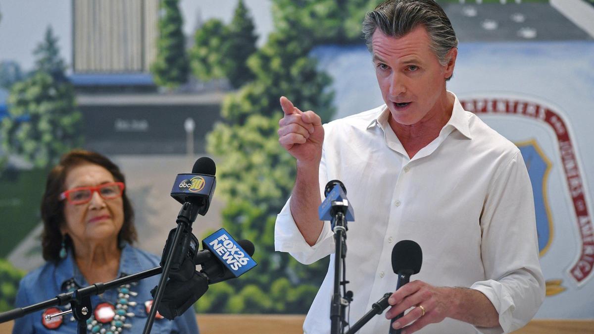 With Dolores Huerta to the left, California Governor Gavin Newsom appears at Carpenters Local 701 to drum up support with less than a week left in the recall election, Thursday, Sept. 9, 2021 in Fresno.