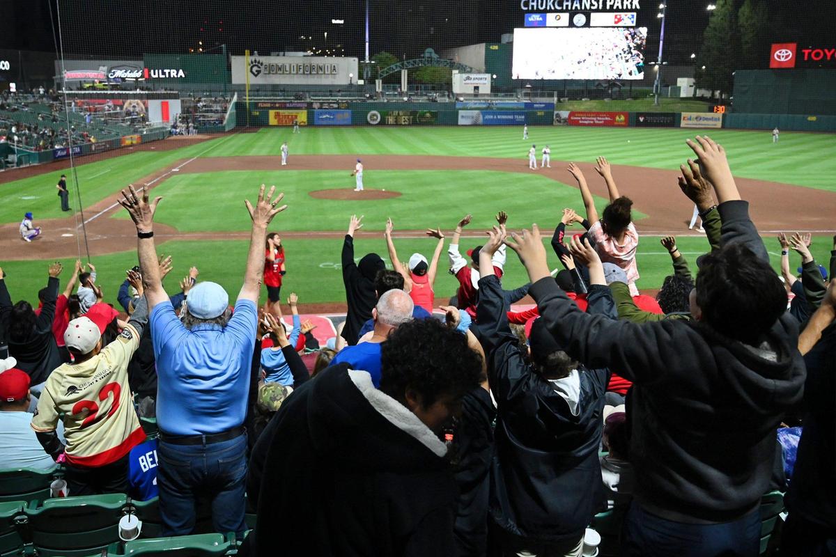 Fans cheer the Fresno Grizzlies in the 2023 season home opener against the Stockton Ports Tuesday, April 11, 2023 in Fresno.