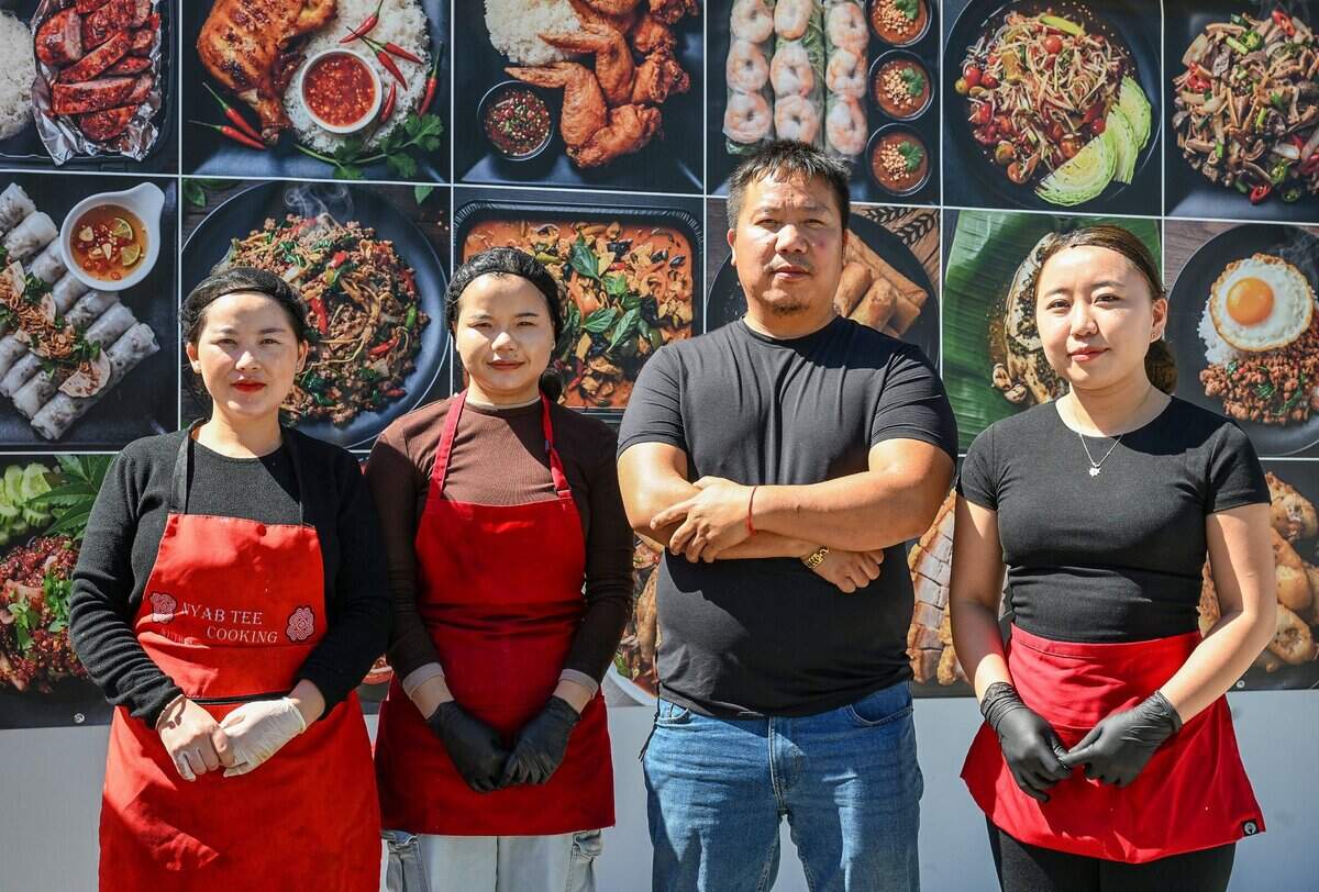 Tee Her, second from right, owns NyabTee's Kitchen with his wife Porxoua Moua. The new Asian restaurant recently opened on First north of Belmont in Fresno. It offers Hmong food but also other Asian influences like Cambodian, Thai and Indian among their dishes. Pictured with Her is his staff from left, Yia Thao, Lavee Vang, and Malee Xiong.