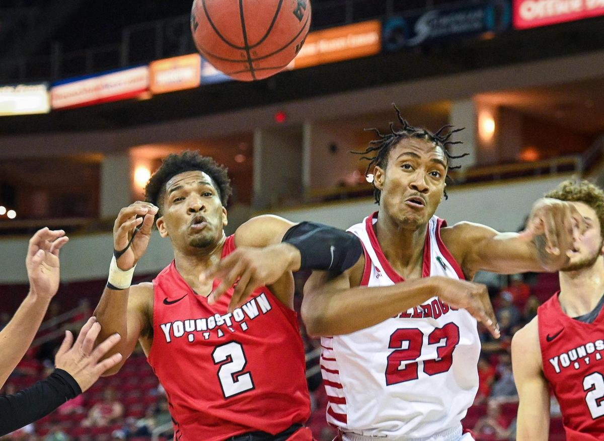 Fresno State’s Leo Colimerio, right, collides with Youngstown’s Tevin Olison while going for a loose ball during their quarterfinal game in the 2022 Basketball Classic tournament at the Save Mart Center in Fresno on Wednesday, March 23, 2022.