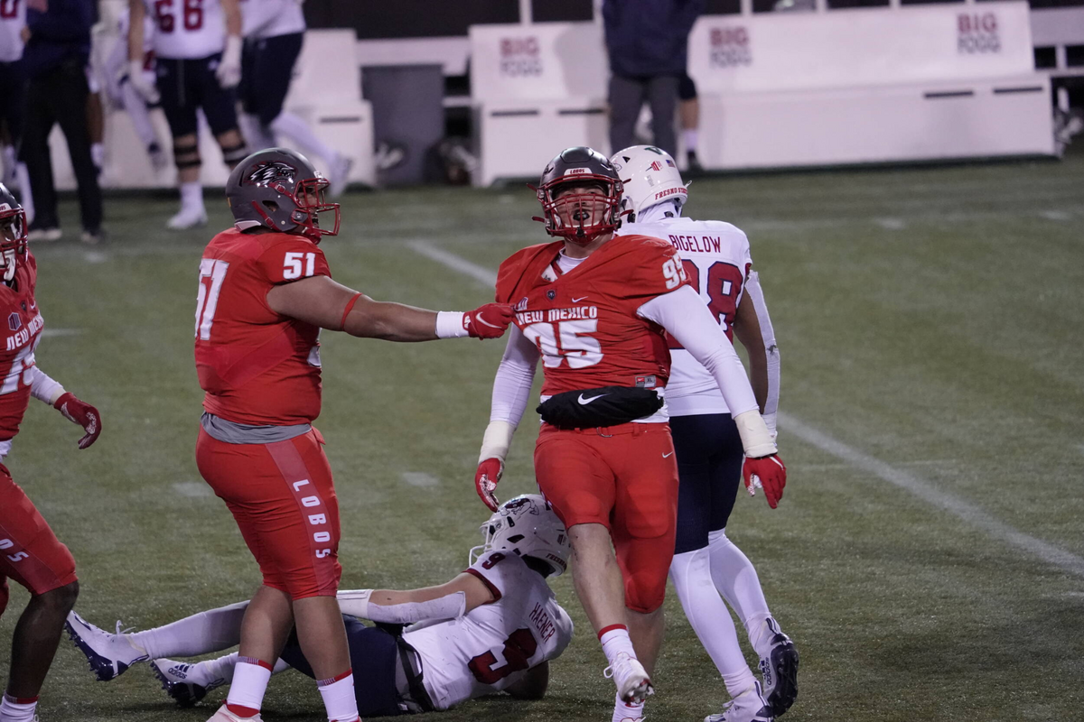 New Mexico Lobos’ defensive end Jake Saltonstall celebrates after sacking Fresno State quarterback Jake Haener in the Bulldogs’ 49-39 loss Saturday at Sam Boy Stadium in Las Vegas.