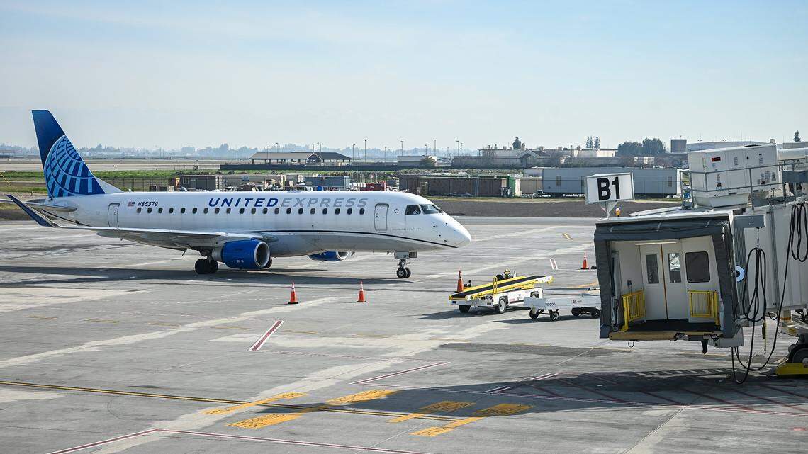 A commercial jet arrives at one of the new Concourse B passenger boarding bridges, part of a $150 million terminal expansion at Fresno Yosemite International on Tuesday, Jan. 13, 2026.