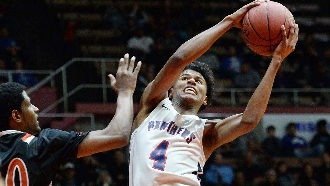 Memorial's Jalen Green, right, gets around Selma's Tiveon Stroud for a shot during their Division II CIF Central Section championship  game at Selland Arena in Fresno on Friday, March 2, 2018.