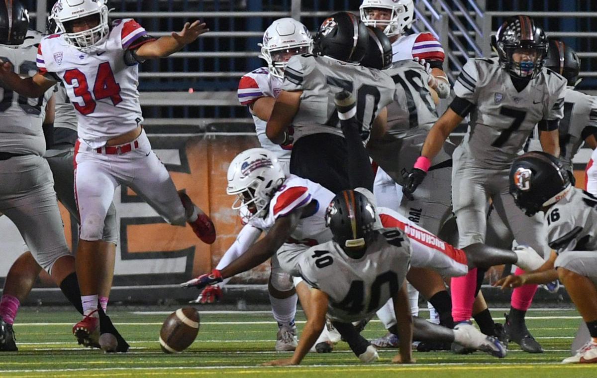 Buchanan scrambles to recover Central’s blocked extra point Friday, Oct. 7, 2022 in Fresno. Buchanan won 49-41.