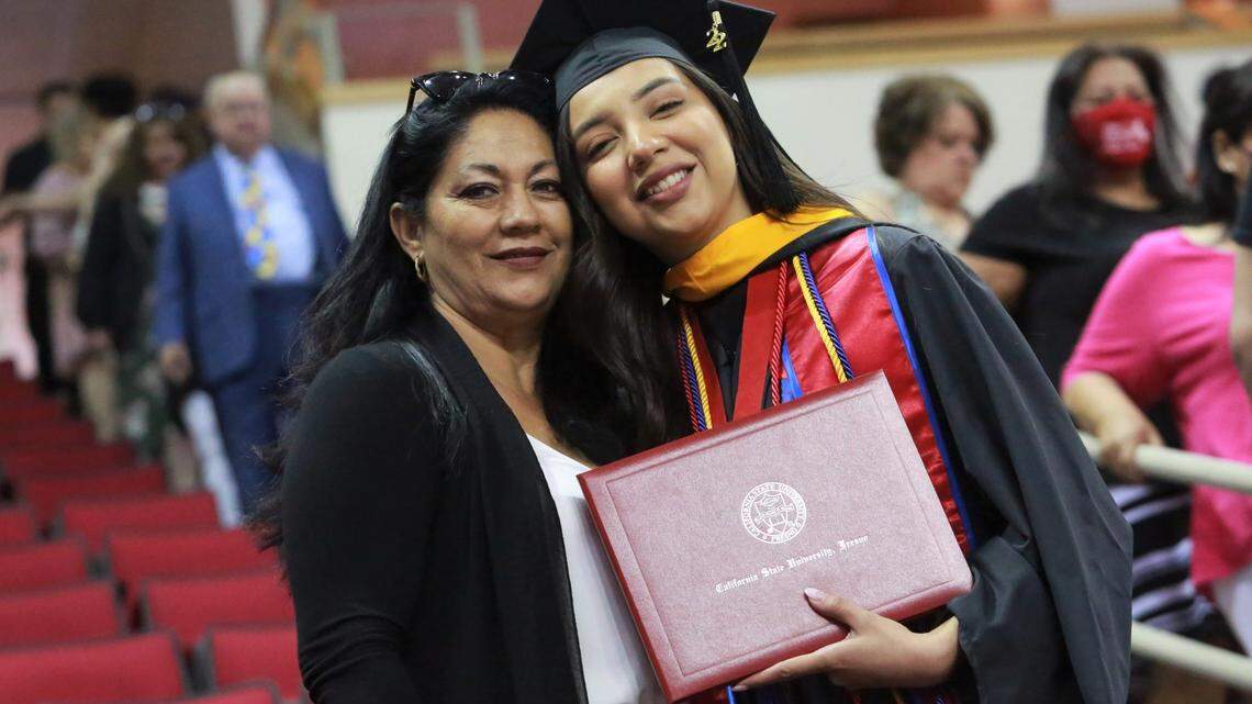 Fresno State’s Tania Castillo with her mother Consuelo Jauregui after in the College of Social Sciences graduation ceremony Friday (May 20) morning at the Save Mart Center. Castillo was selected as the graduate dean’s medalist for the College of Social Sciences. She earned her master’s degree in criminology with a 4.0 GPA.