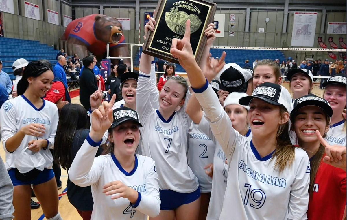 Buchanan’s Savanna FauntLeRoy, center, holds up the championship plaque as the team celebrates its win over Central Valley Christian in the Central Section’s DII Girls Volleyball Championship Thursday, Nov. 3, 2022 in Clovis. The Buchanan Bears won the final fifth set after both teams went 2-2.