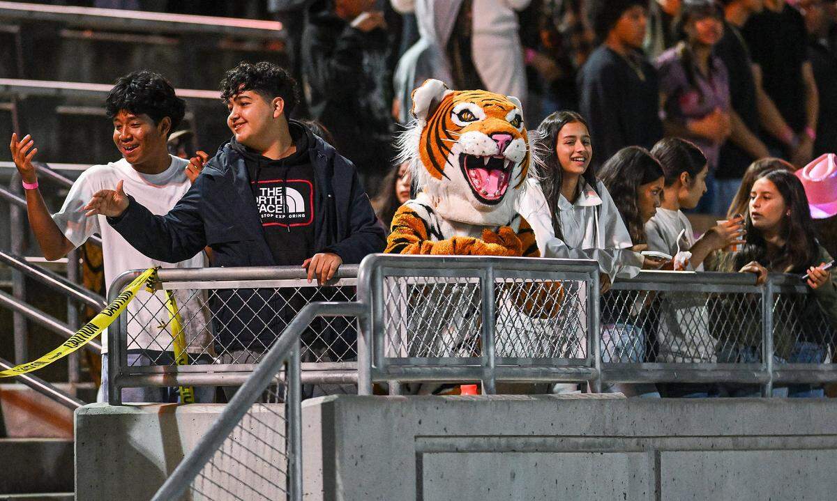 Central East's Bengal mascot hangs out with the students during the football teams playoff game against Clovis East at Deran Koligian Stadium in Fresno on Friday, Nov. 7, 2025.